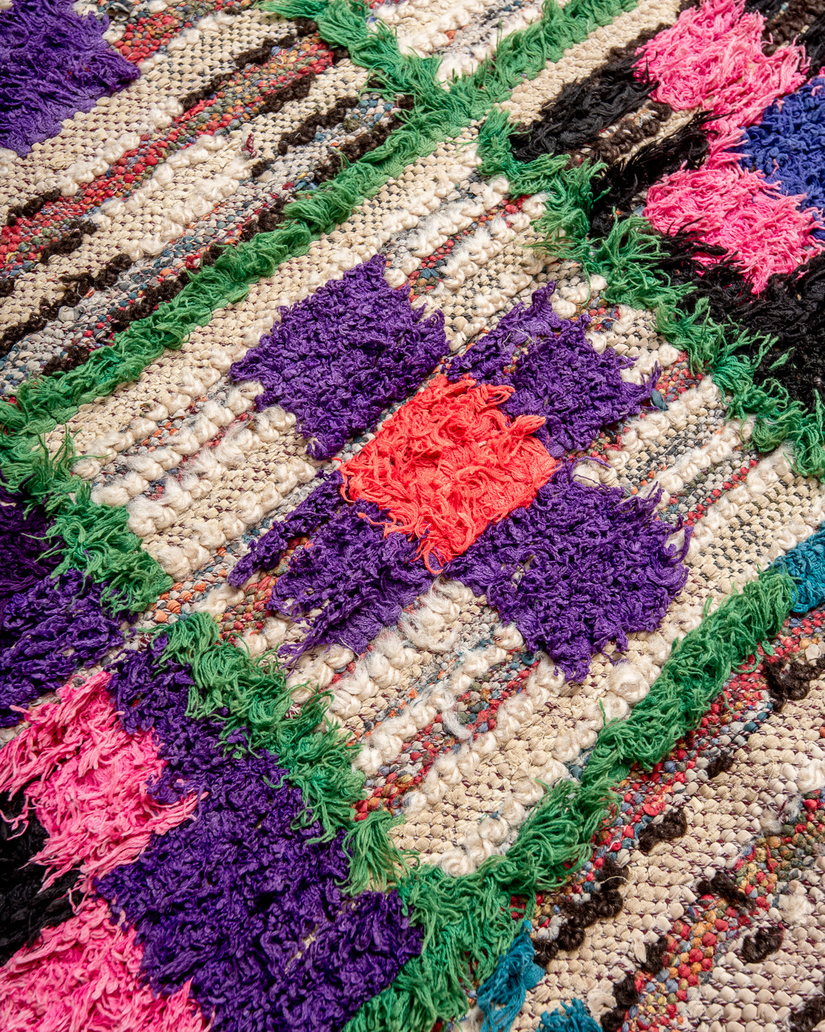 Modern designer vintage handcrafted Berber rug from Morocco. Boucherouite runner rug with beautiful colors and patterns.